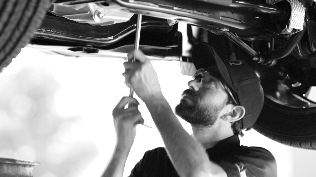 A service technician tuning up your Nissan in Mayfield Heights, OH
