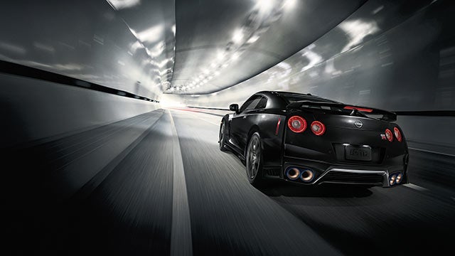 2023 Nissan GT-R seen from behind driving through a tunnel | Ken Ganley Nissan Mayfield in Mayfield Heights OH