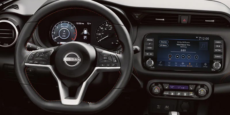 The steering wheel and console dash of the 2024 Nissan Kicks in Mayfield Heights, OH