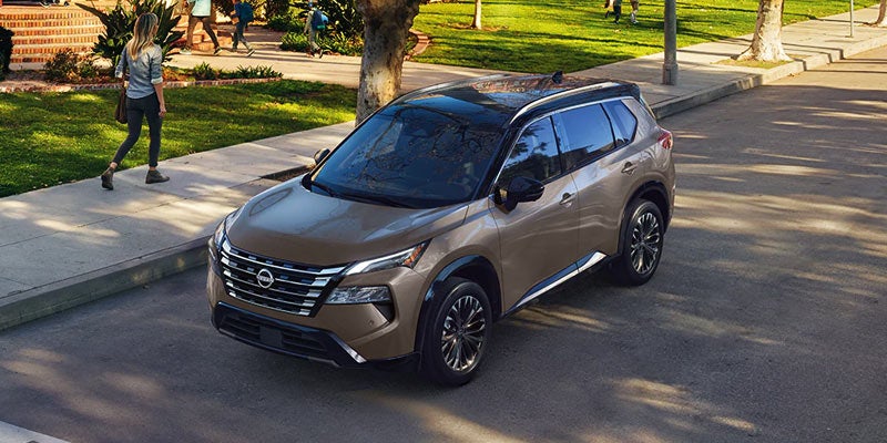 A 2024 Nissan Rogue parked in front of a house in Mayfield Heights, OH