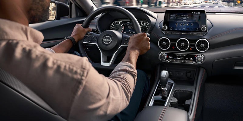 A driver ready to ride in their 2024 Nissan Sentra in Mayfield Heights, OH