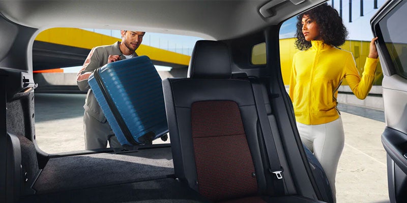 A couple coming back from the airport and loading up their 2025 Nissan Kicks in Mayfield Heights, OH